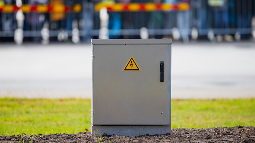 Custom powder-coated metal electrical enclosure showing precision cutouts and quality finish